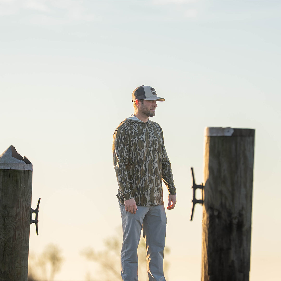 Lightweight bamboo long sleeve hoodie with UPF 50+ sun protection, moisture-wicking fabric, and breathable design for hunting, fishing, hiking, and outdoor adventures.