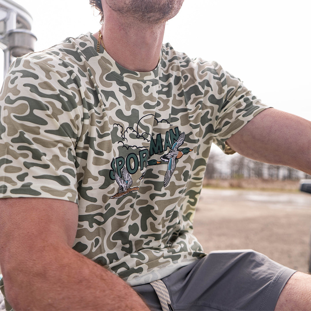 Performance bamboo blend short sleeve T-shirt with camouflage print, wildlife designs on pocket, breathable and stretchy, perfect for hunting, fishing, and outdoor activities.
