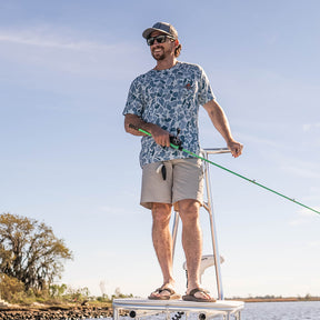 Performance bamboo blend short sleeve T-shirt with camouflage print, wildlife designs on pocket, breathable and stretchy, perfect for hunting, fishing, and outdoor activities.