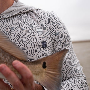 Lightweight bamboo long sleeve hoodie with UPF 50+ sun protection, moisture-wicking fabric, and breathable design for hunting, fishing, hiking, and outdoor adventures.
