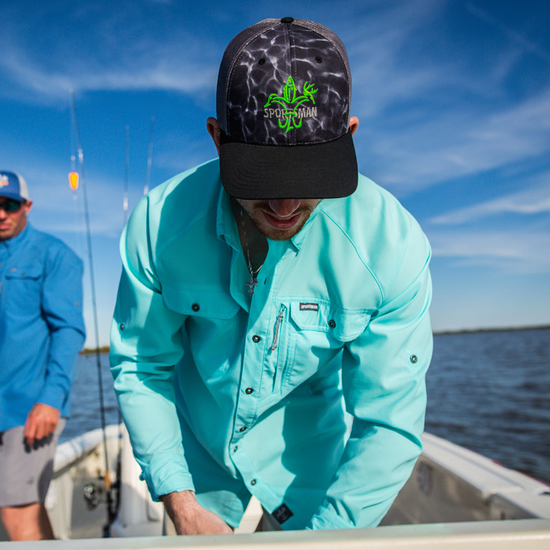 sportsman spooler long sleeve button down fishing shirt light blue and black camo mesh snapback hat